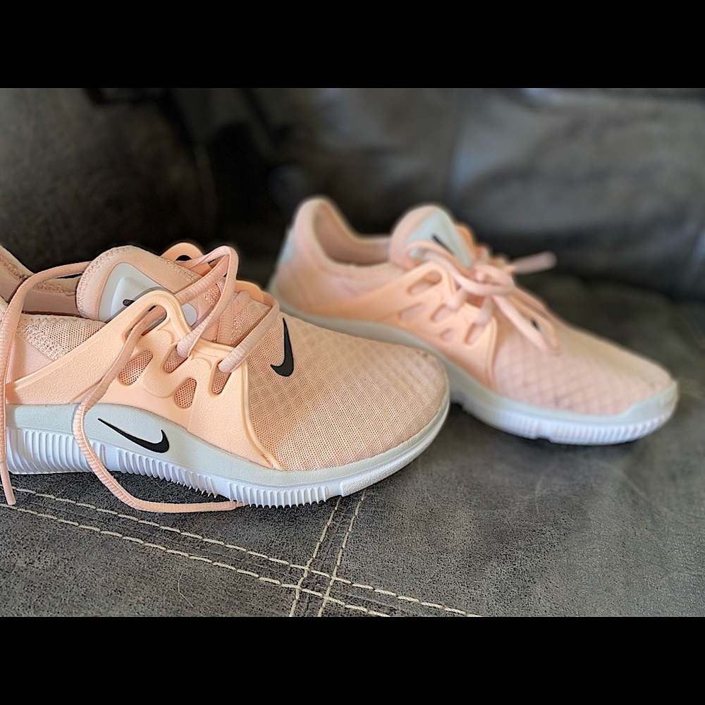 Woman’s Nike running shoes only wore them once ..cute peachy color